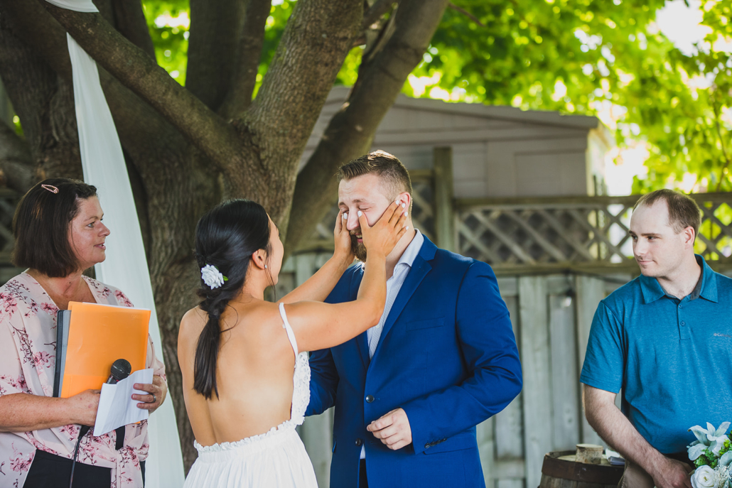 bride wiping grooms tears