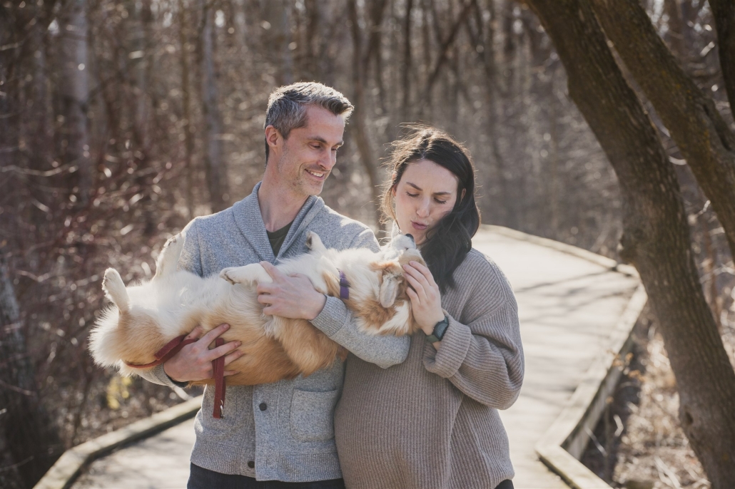 a couple and their corgi on the Collingwood boardwalk