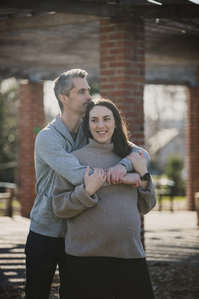 snuggling couple in spring sunshine